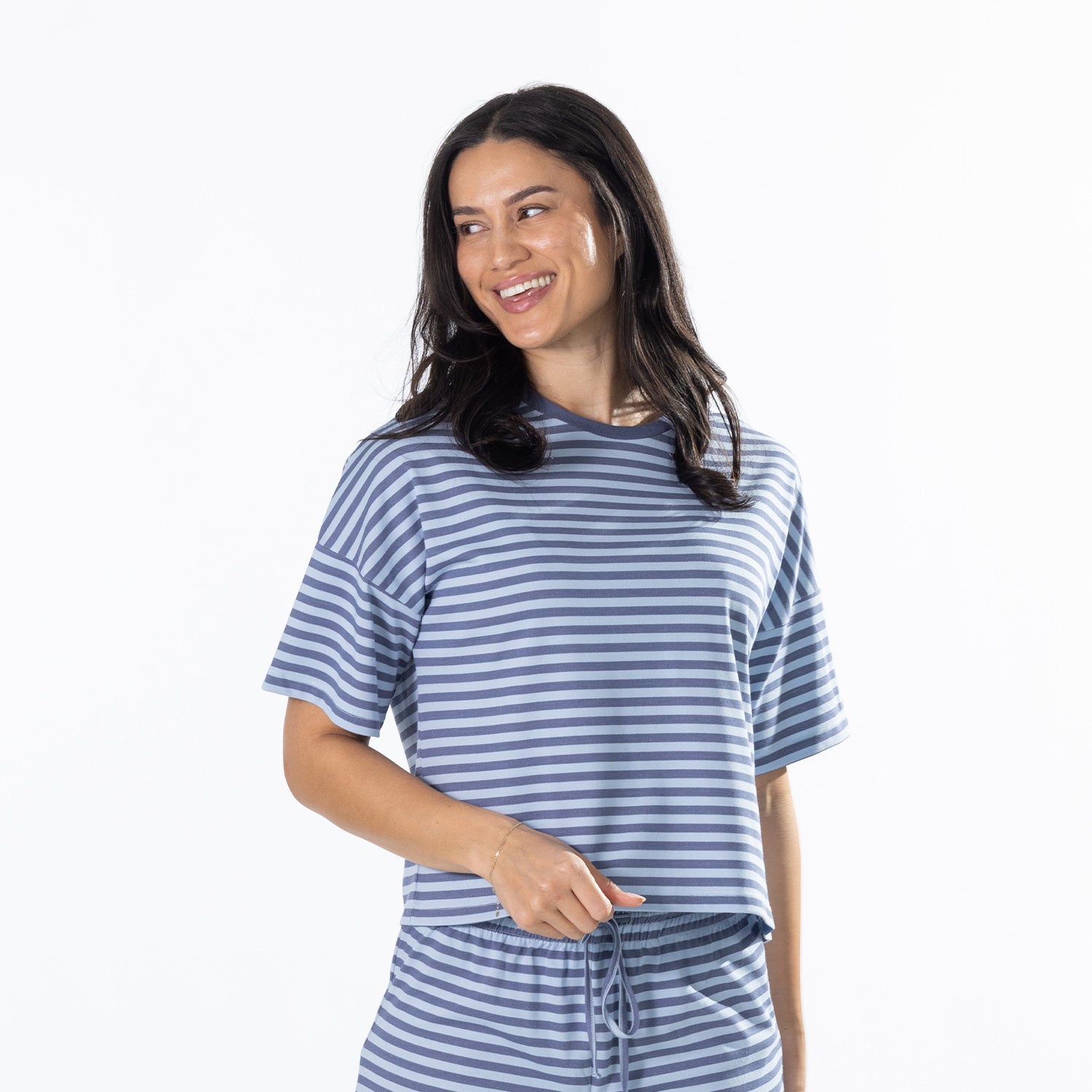 Woman wearing the Simple & Sunday Lounge Relaxed Stripe Tee in Faded Blue with matching lounge pants.