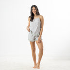 Full-length front view of a woman modelling the pink contrast frill cami and shorts pyjama set.