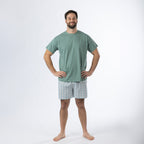 Design Plus Men’s Check PJ Set Blue, featuring a sage green short-sleeve T-shirt with blue and white check shorts, shown full length on a model.