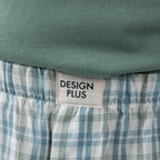 Close-up of the Design Plus Men’s Check PJ Set Blue, showing the Design Plus label and blue check pattern on the shorts.
