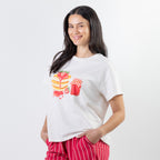 A relaxed-fit white sleep tee features a playful pancake and strawberry jam graphic, adding a fun, feel-good touch to cosy nights and lazy mornings.