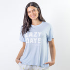 A soft blue sleep tee featuring a "Lazy Days and Sleeping In" graphic offers a relaxed, laid-back style that's perfect for cosy nights and slow mornings.