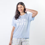A soft blue sleep tee featuring a "Lazy Days and Sleeping In" graphic offers a relaxed, laid-back style that's perfect for cosy nights and slow mornings.