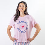 A soft pink sleep tee features a playful heart graphic with the words "L'Amour Est Déclaré," creating a sweet, feminine look that's perfect for cosy nights and relaxed mornings.