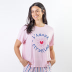 A soft pink sleep tee features a playful heart graphic with the words "L'Amour Est Déclaré," creating a sweet, feminine look that's perfect for cosy nights and relaxed mornings.