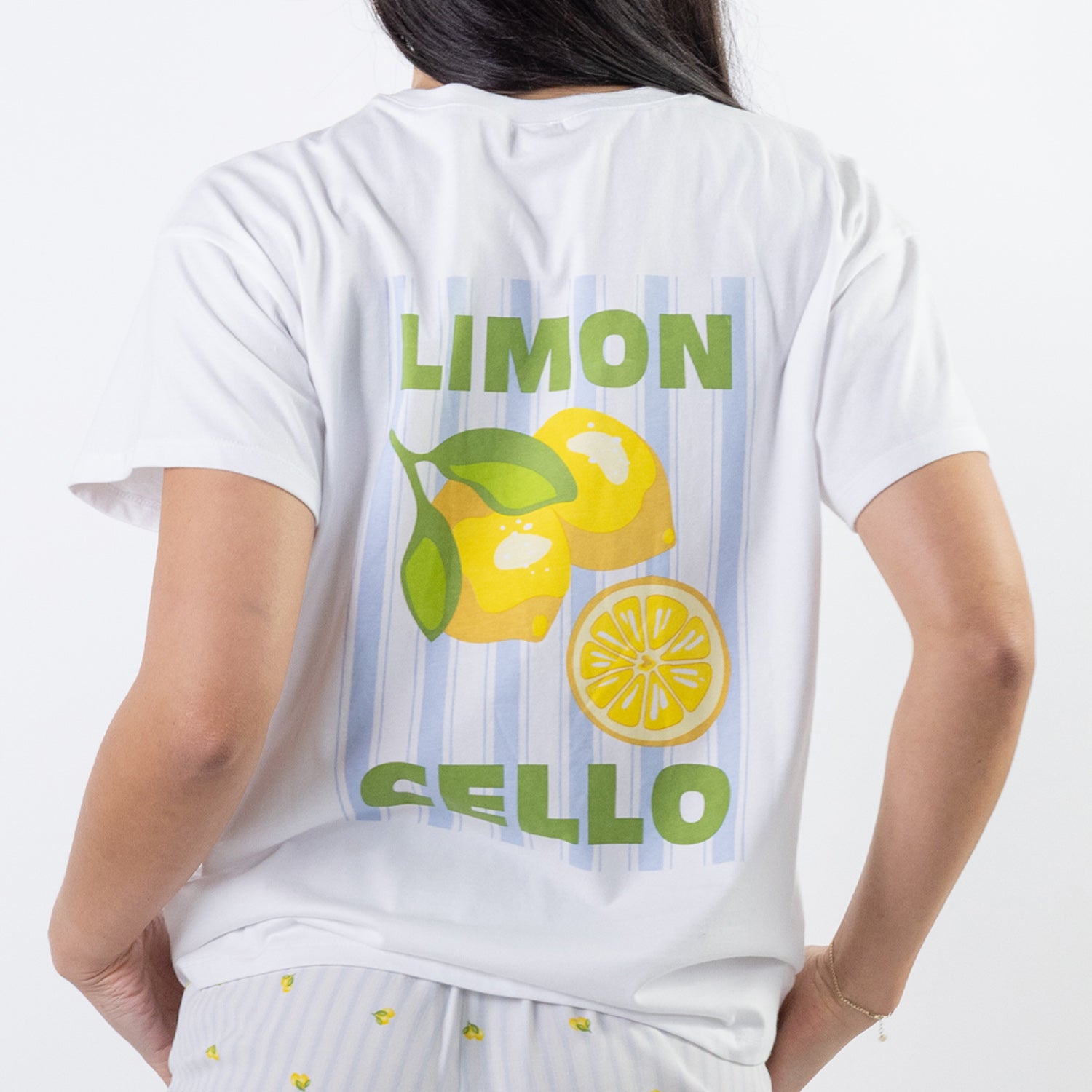 Close-up back view of the bb&b Sleep Limoncello Print Sleep Tee in White, highlighting the colourful lemon illustration, striped background and “Limon Cello” print.