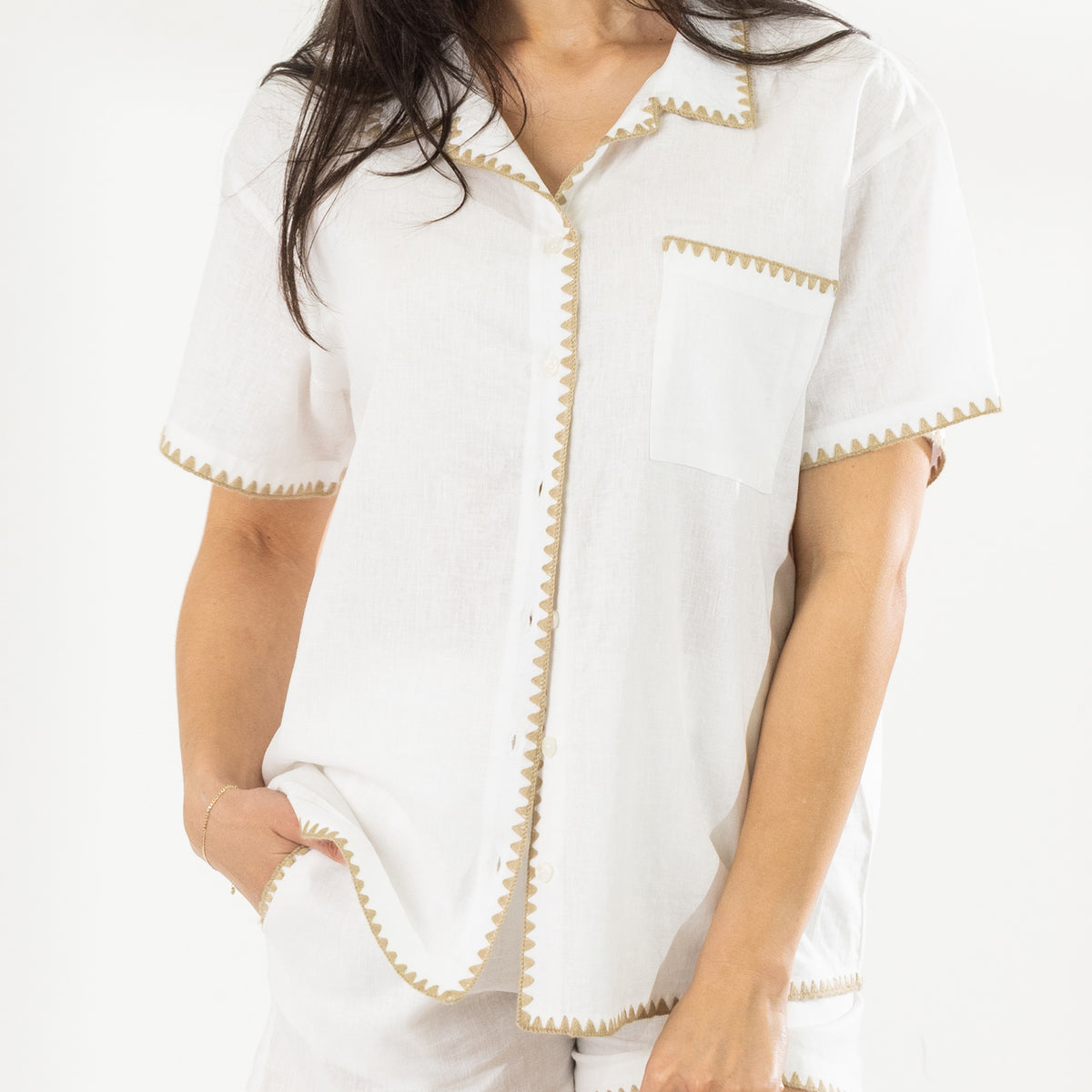 Close-up of the Cove Breeze Stitch Shirt in Ivory showing the button front, chest pocket, sleeves and contrast stitch trim.