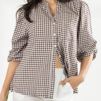 Close-up of the Cove Breeze Collarless Shirt in Chocolate Check, showing the button front, collarless neckline and three-quarter sleeves.