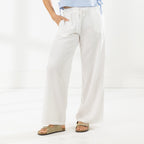 Close-up of the Cove Breeze Wide Leg Pants in Ivory, highlighting the elasticated drawstring waistband, side pockets and relaxed wide-leg fit.