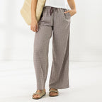 Front view of the Cove Wide Leg Pants in Chocolate, showing the gingham check pattern, wide-leg fit and side pockets.