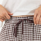 Close-up of the Cove Wide Leg Pants in Chocolate, highlighting the elasticated waistband and chocolate drawstring tie.