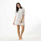 Full-length front view of the ivory oversized sleep tee featuring pink and blue macaroon motifs and a relaxed loose fit.