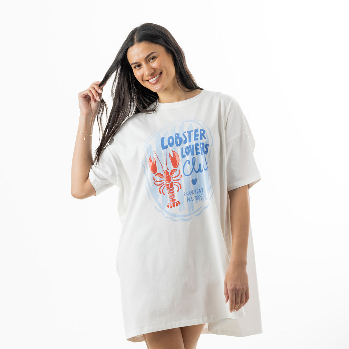 Woman modelling a white oversized sleep tee featuring a large blue and orange Lobster Lovers Club graphic on the front.