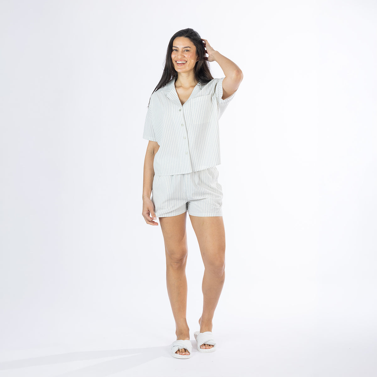 Full-length view of the Amparo Sophie Stripe PJ Set in Blue, featuring a button-up striped top and matching shorts.