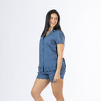 Model wearing the Gracious Living Olivia Embroidered Short PJ Set in navy, featuring a button-front top and matching shorts with scalloped embroidered trims, shown from a side angle.