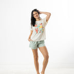 Model posing in an off-white bb&b Sleep Lobster Print Sleep Tee with mint green striped pyjama shorts against a white background.