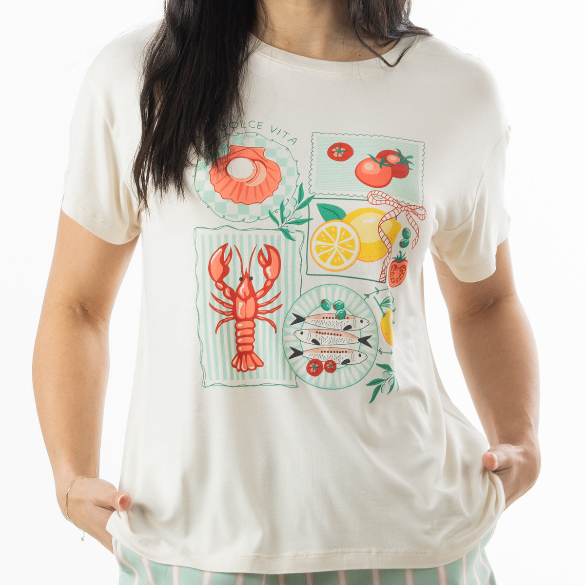 Close-up of the off-white bb&b Sleep Lobster Print Sleep Tee showing colourful lobster, fish, tomato, lemon and seashell illustrations.