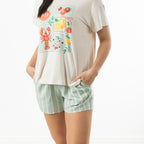 Close-up of a model wearing bb&b Sleep Mint Stripe Pyjama Shorts with a cream graphic tee, highlighting the relaxed silhouette and striped shorts.