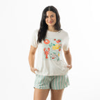 Model wearing bb&b Sleep Mint Stripe Pyjama Shorts with a cream graphic tee, featuring a relaxed fit and soft mint and pink vertical stripes.