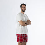 Design Plus Men’s Check PJ Set Red, shown on a model with arms crossed, highlighting the white T-shirt and red check shorts.