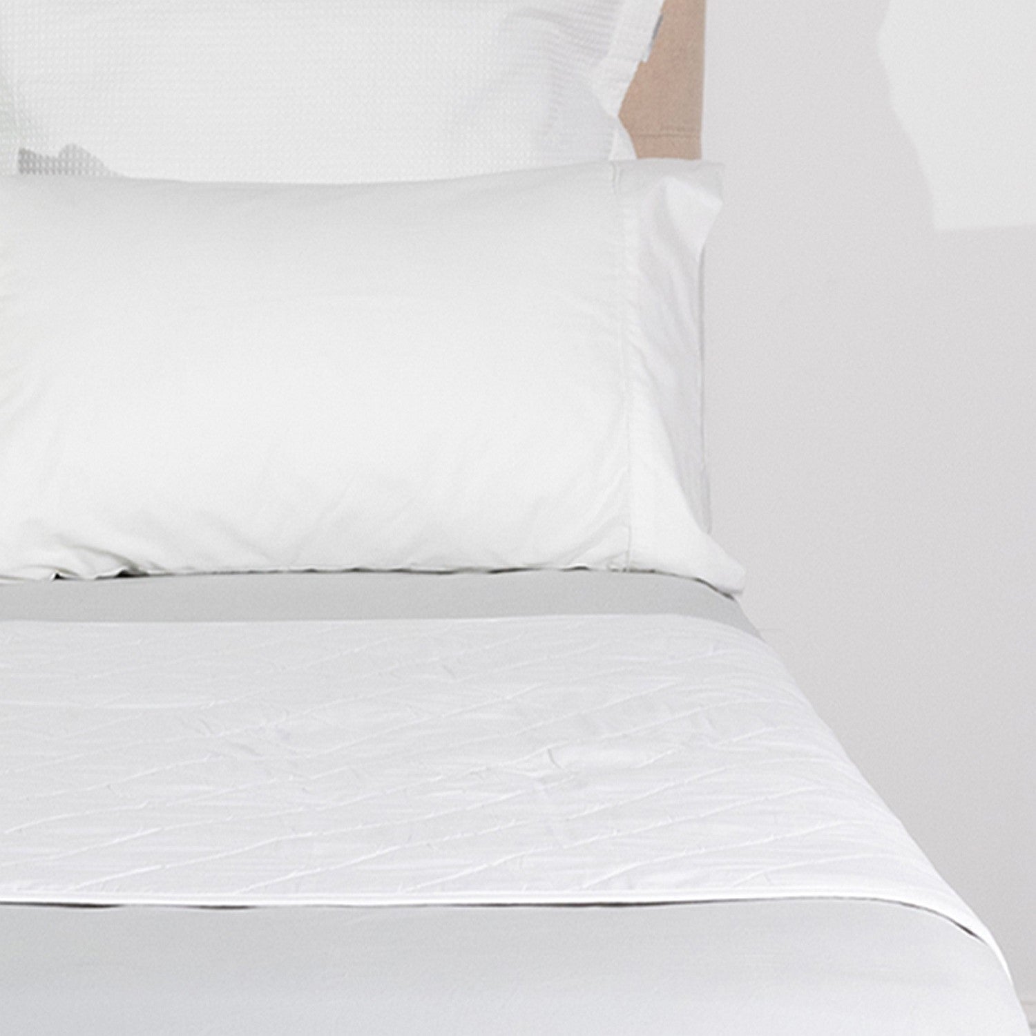 Cloud 9 Mattress or Sheet Waterproof Protector fitted beneath bedding, providing discreet waterproof protection and comfort.