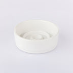 White ceramic bowl on a light gray background