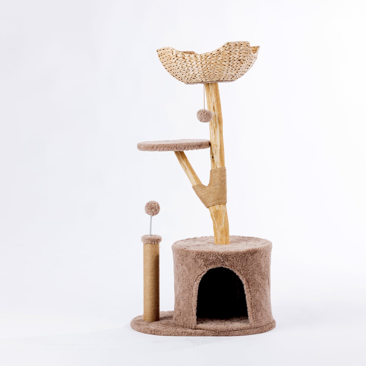 Mocha cat tower with a plush hideaway cubby, woven basket bed, elevated perch, sisal scratching post, and hanging pom-pom toy on a white background.
