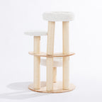 Rear view of the round natural timber cat tower showing three plush cat beds, curved wooden platforms, and sisal scratching posts.