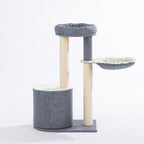 Rear view of the grey and cream cat tower showing the enclosed hideaway, elevated bed, suspended hammock, and sisal-wrapped scratching posts.