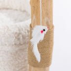 Close-up of the white plush mouse toy with pink ears hanging from the elevated perch of the cream cat scratcher.