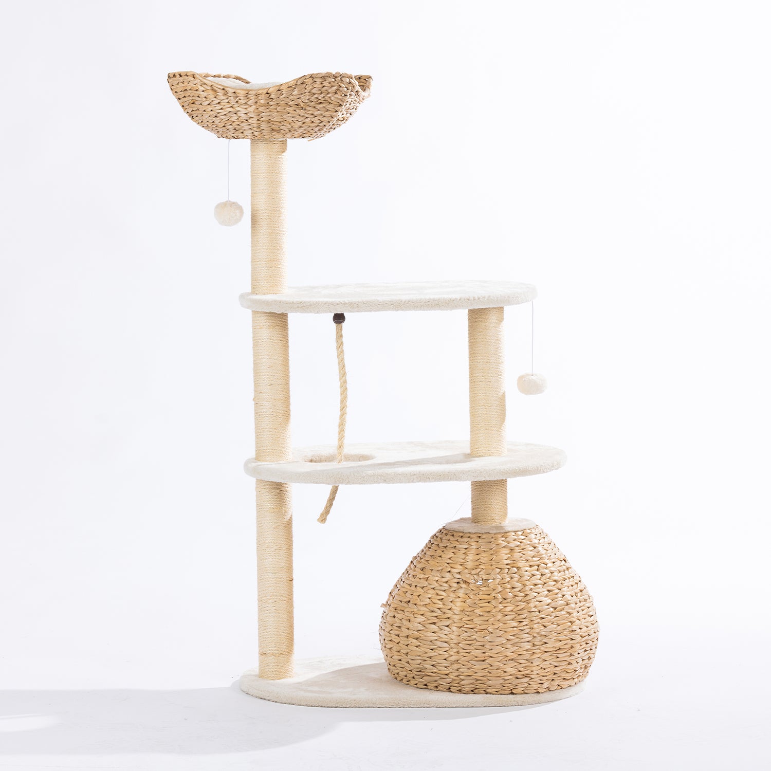 Rear view of the natural woven cat tower showing the woven hideaway, plush platforms, sisal scratching posts, climbing rope, and hanging pom-pom toys on a white background.
