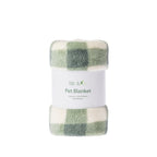 A folded plush pet blanket with a green and cream plaid pattern, wrapped in a white paper band labeled 'bb&b Pet Pet Blanket'.