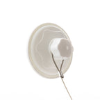 A close-up of a white circular suction cup  shown on a plain white background.