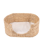 bb&b Pets Pet Fish Bone Weave Basket in Natural, featuring a rounded water hyacinth woven design, lowered front opening and soft cream cushion for a cosy pet resting spot.