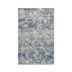 Home Co. Soft Ribbed Everly Rug (120 × 180cm) in Denim, featuring a subtle floral vine pattern in soft denim blue and ivory with a textured ribbed finish.
