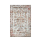 Home Co. Soft Ribbed Everly Rug (120 × 180cm) in Pink, featuring a distressed retro-inspired pattern with geometric motifs in soft pink, ivory, taupe, and warm neutral tones.