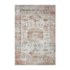 Home Co. Soft Ribbed Everly Rug (160 × 230cm) in Pink, featuring a distressed retro-inspired pattern with geometric motifs in soft pink, ivory, taupe, and warm neutral tones.