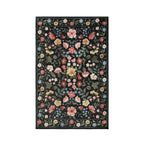 Home Co. Soft Ribbed Everly Rug (120 × 180cm) in Charcoal, featuring a colourful botanical floral pattern with pink, yellow, blue and cream flowers on a charcoal background with a textured ribbed finish.