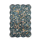 Home Co. Ribbed Scallop Everly Rug (120 × 180cm) in Teal, featuring a scalloped edge and an all-over floral botanical print in soft cream, blush, mustard and peach tones with a textured ribbed finish.