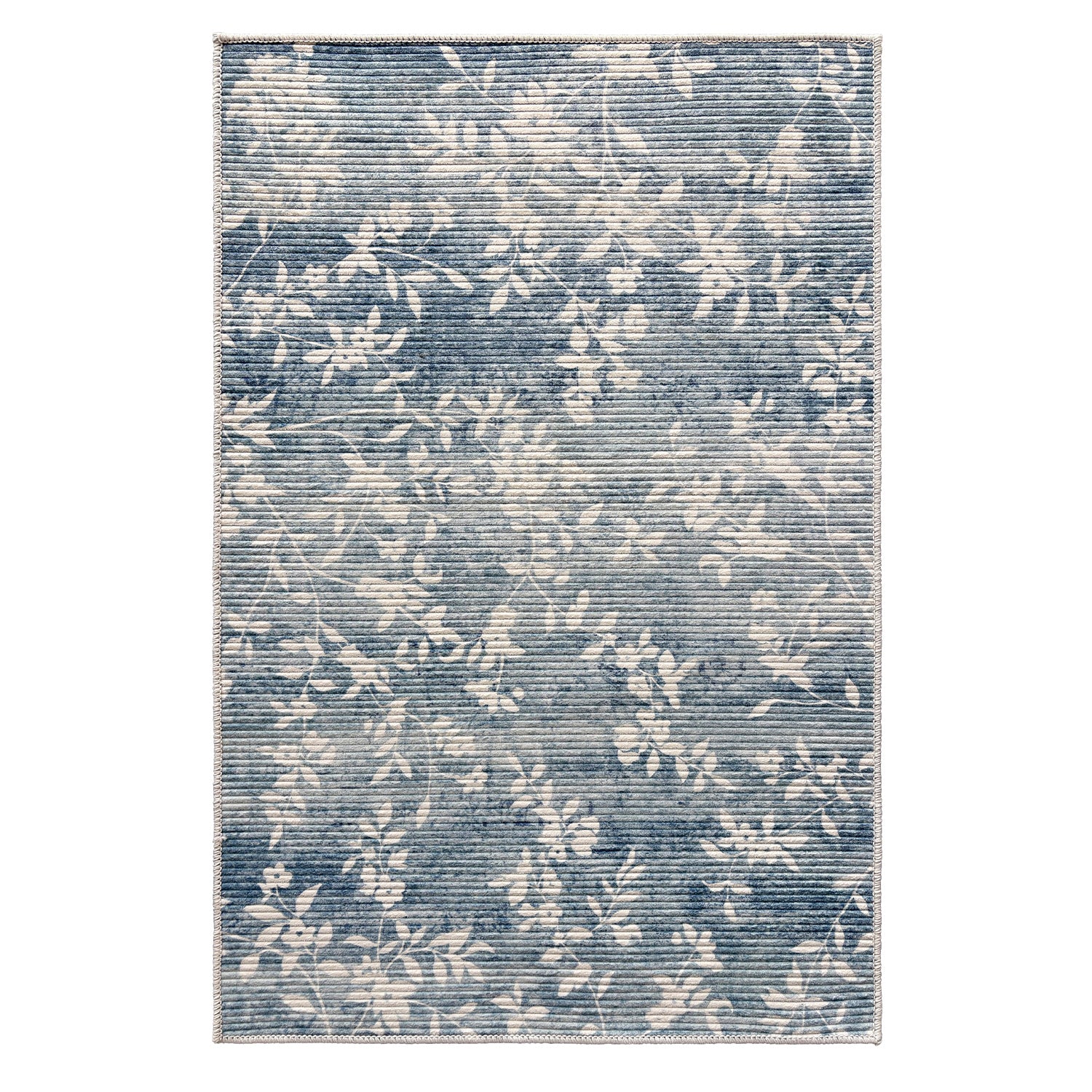 Home Co. Soft Ribbed Everly Rug (200 × 300cm) in Denim, featuring a subtle floral vine pattern in soft denim blue and ivory with a textured ribbed finish.