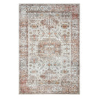 Home Co. Soft Ribbed Everly Rug (200 × 300cm) in Pink, featuring a distressed Retro-inspired pattern with geometric motifs in soft pink, ivory, taupe, and warm neutral tones.