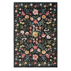Home Co. Soft Ribbed Everly Rug (200 × 300cm) in Charcoal, featuring a colourful botanical floral pattern with pink, yellow, blue and cream flowers on a charcoal background with a textured ribbed finish.