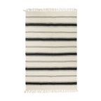 Home Co.  Natural Stripe Rug (120 x 180cm) featuring alternating grey and natural woven stripes with decorative fringe edges on both ends.
