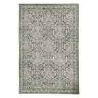A traditional-style rug in muted Khaki and ivory features an intricate floral damask pattern with an ornate border for a timeless, elegant look.
