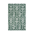 Green rug with a white floral trellis pattern, shown flat on a white background.
