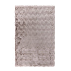 A luxuriously soft faux fur rug with a subtle textured pattern and plush pile brings warmth, comfort, and understated elegance to any living space.