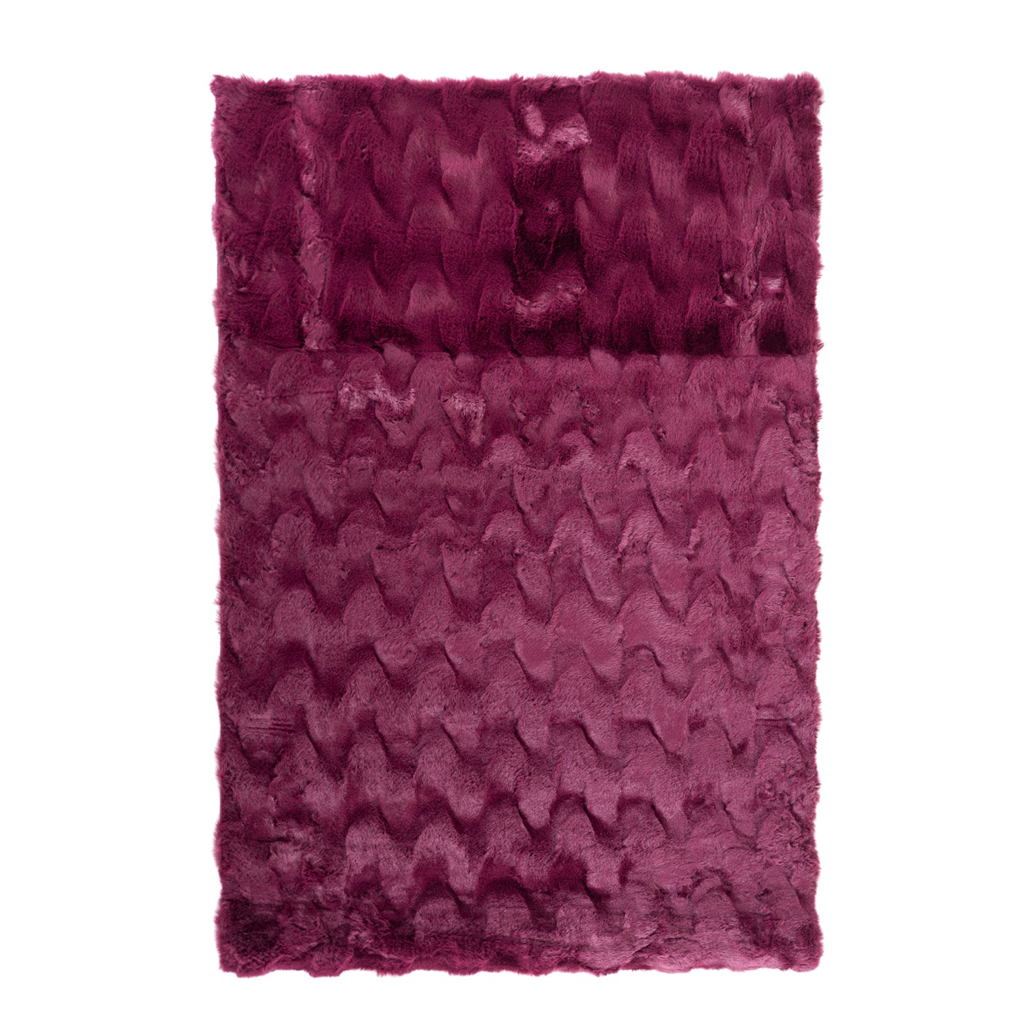 A luxuriously soft faux fur rug with a subtle textured pattern and plush pile brings warmth, comfort, and understated elegance to any living space.