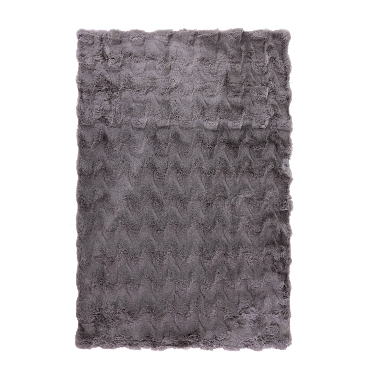 A luxuriously soft faux fur rug with a subtle textured pattern and plush pile brings warmth, comfort, and understated elegance to any living space.