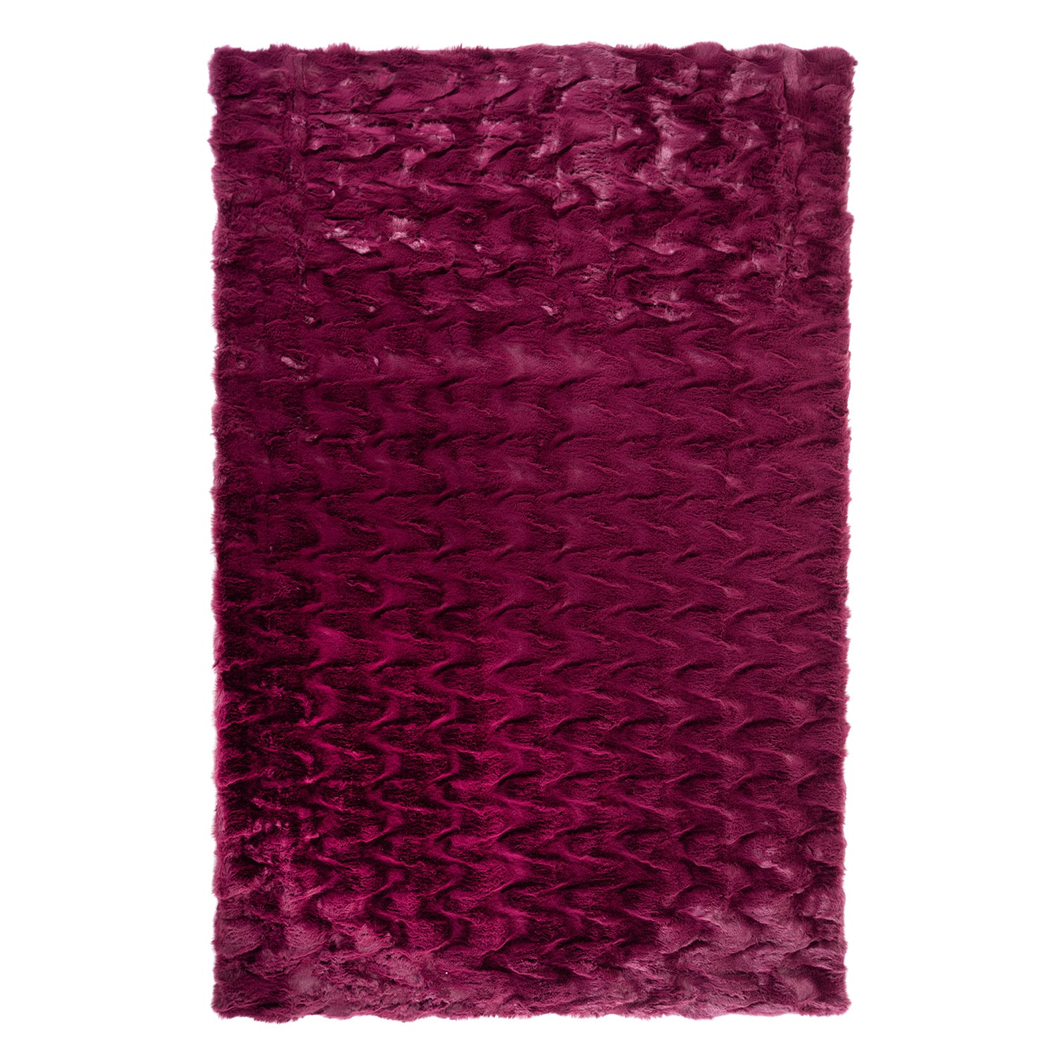 A luxuriously soft faux fur rug with a subtle textured pattern and plush pile brings warmth, comfort, and understated elegance to any living space.