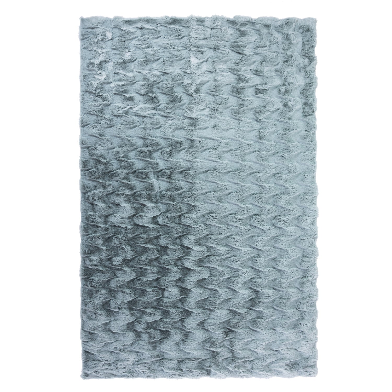 A luxuriously soft faux fur rug with a subtle textured pattern and plush pile brings warmth, comfort, and understated elegance to any living space.